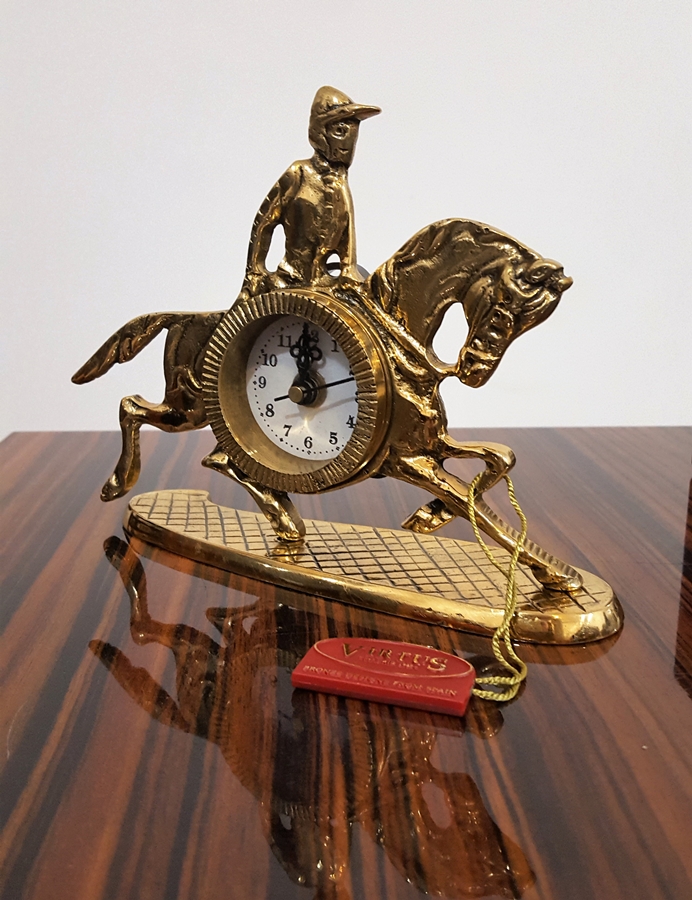 Fascinating bronze clock with a jockey on a horse