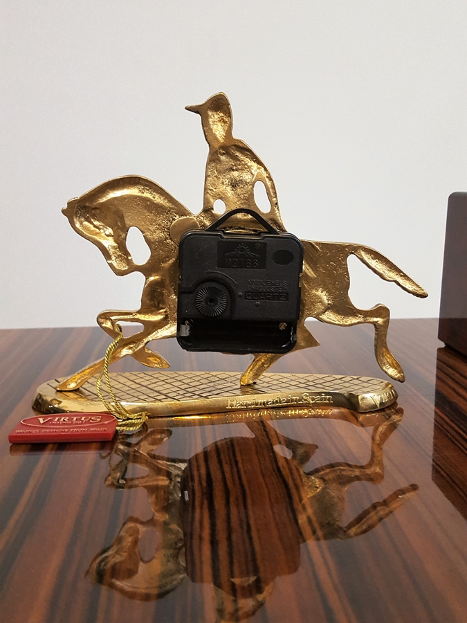 Fascinating bronze clock with a jockey on a horse