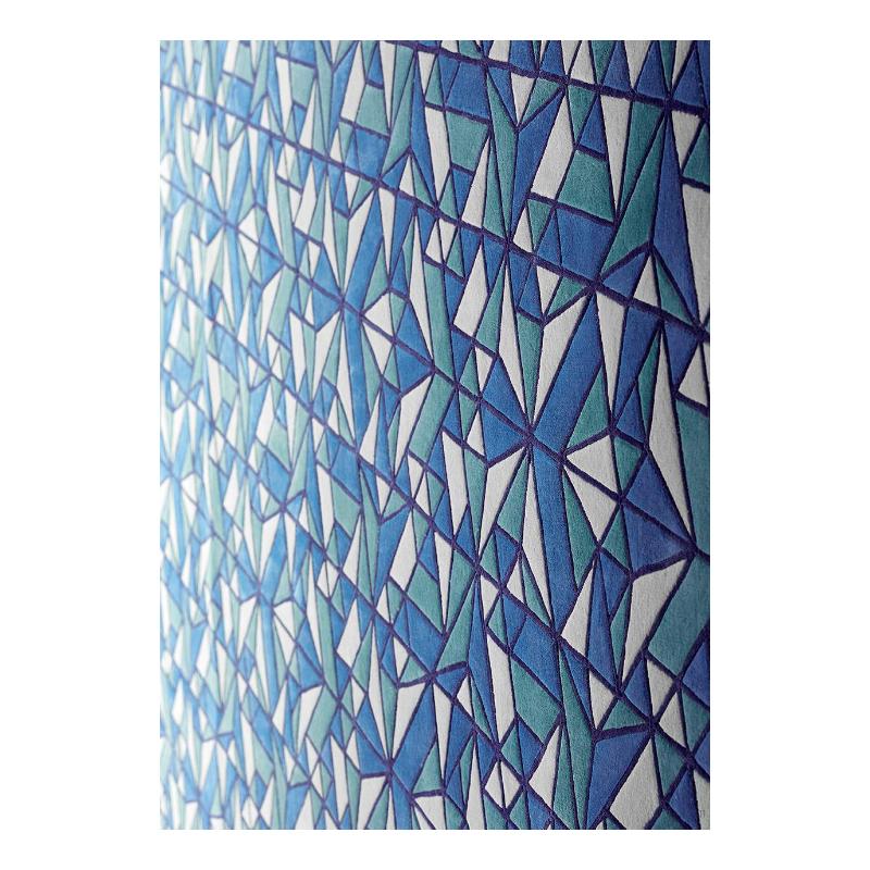 Blue and green carpet with a kaleidoscope pattern