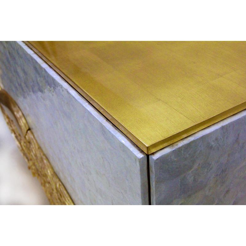 An exclusive chest of drawers with a beautiful golden peacock Luxury